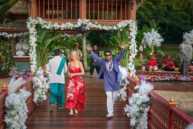 (L to R) Melanie Laurent as Claudette Joubert and Adeel Akhtar as Maharajah in Murder Mystery 2. Cr. Scott Yamano/Netflix © 2023.